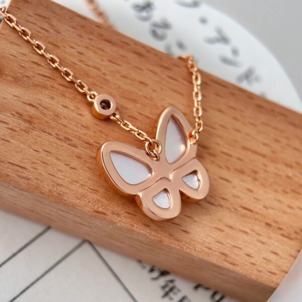 White mother-of-pearl necklace with diamond inlays and a butterfly design