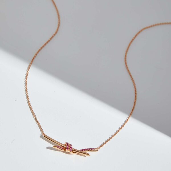 Knot light blue sapphire necklace