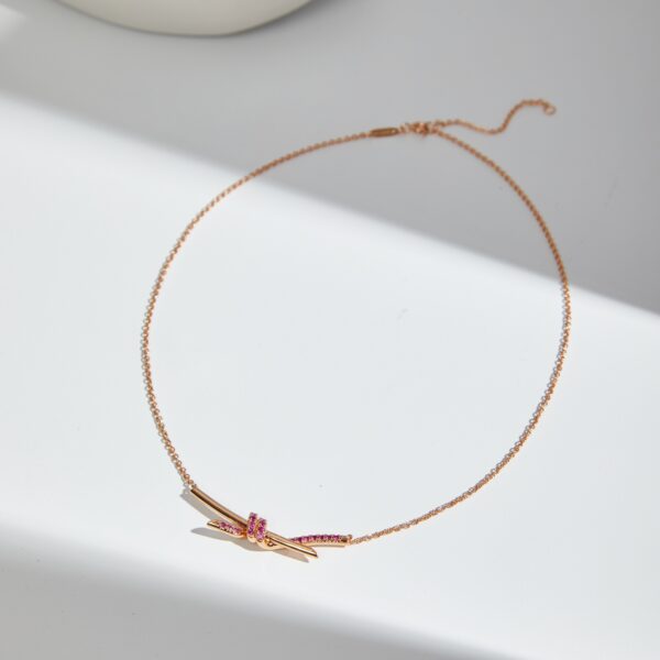 Knot light blue sapphire necklace